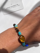 Load image into Gallery viewer, Tigers eye X Nazar Speak Your Truth Charm Bracelet